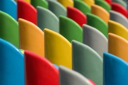 Chair backs of differing bright primary colors