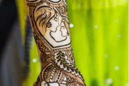 Tribal designs on a womans forearm